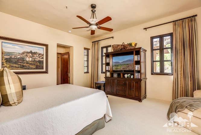 72275 Upper Way West Palm Desert, CA 92260 - Photo 53 of 90 a bedroom with a bed and a flat screen tv