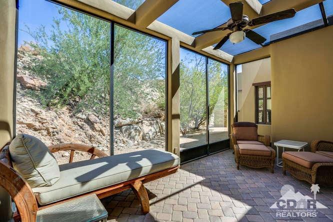 72275 Upper Way West Palm Desert, CA 92260 - Photo 54 of 90 a living room with furniture and a floor to ceiling window