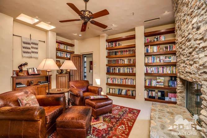 72275 Upper Way West Palm Desert, CA 92260 - Photo 62 of 90 a living room with furniture and a book shelf