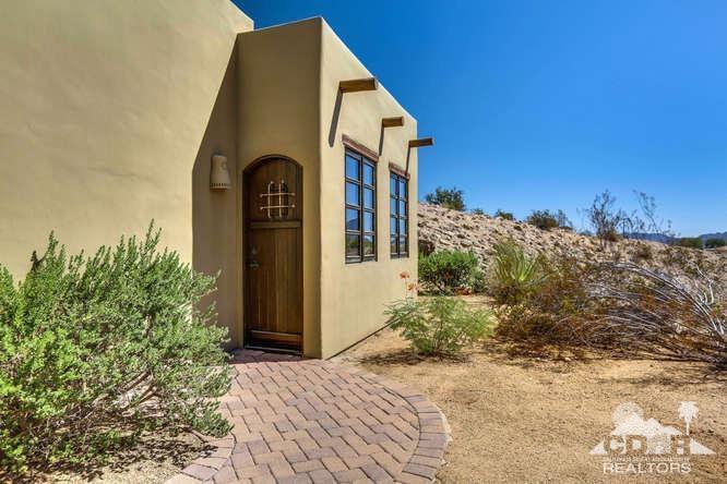 72275 Upper Way West Palm Desert, CA 92260 - Photo 67 of 90 a front view of a house with a yard