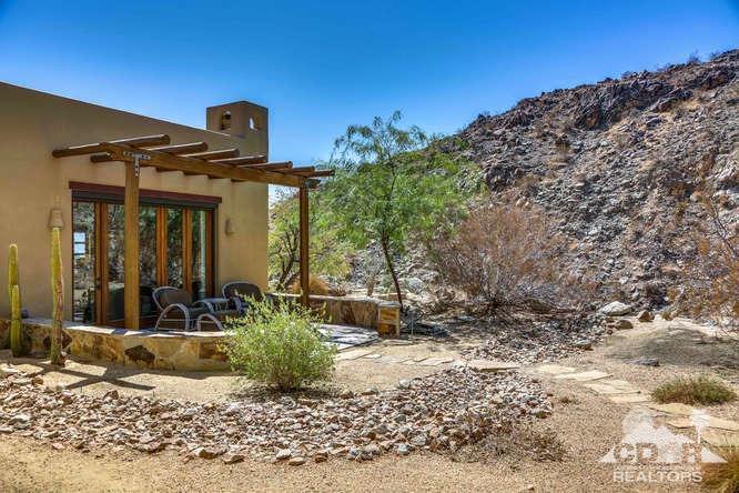 72275 Upper Way West Palm Desert, CA 92260 - Photo 74 of 90 a front view of a house with a yard