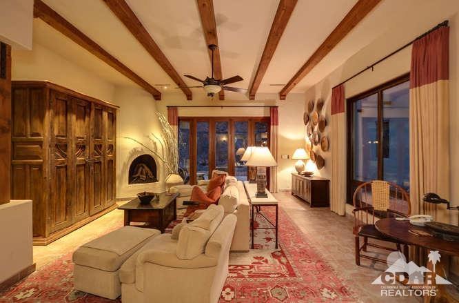 72275 Upper Way West Palm Desert, CA 92260 - Photo 89 of 90 a living room with furniture a fireplace and rug floor