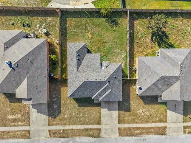 aerial view of a house with a ocean view