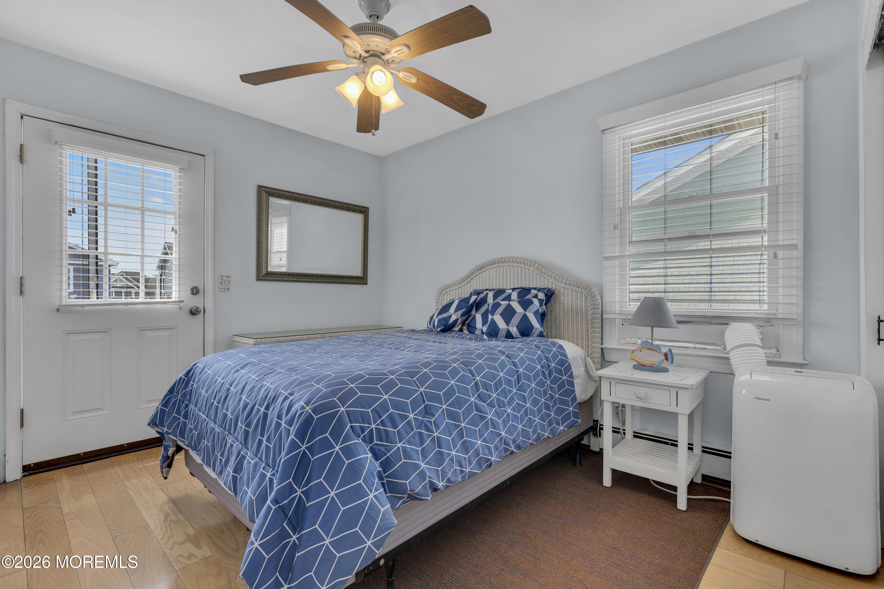 8 President Avenue, Unit 1 Lavallette, NJ 08735 - Photo 11 of 18 a bedroom with a bed and a window