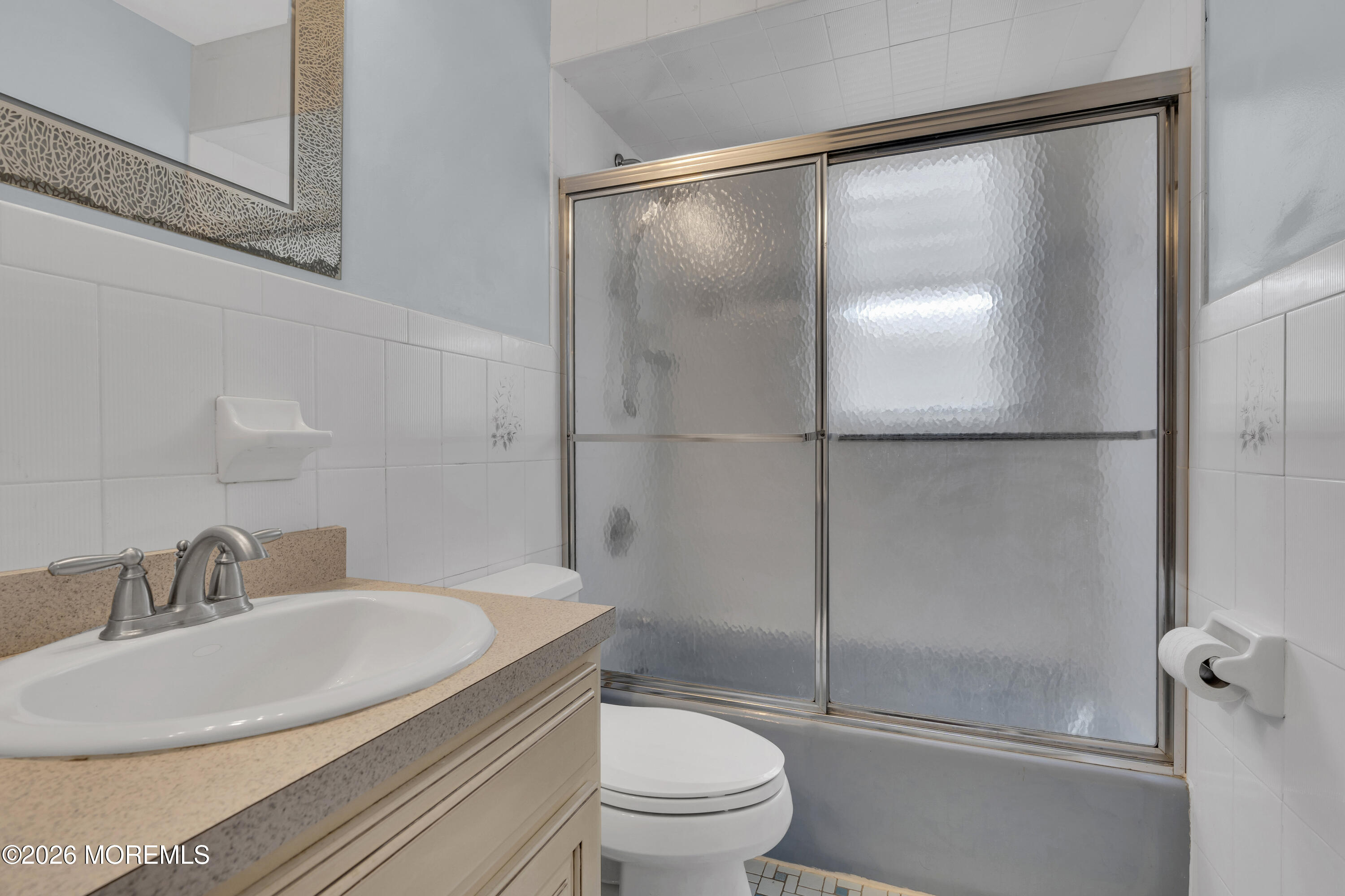 8 President Avenue, Unit 1 Lavallette, NJ 08735 - Photo 14 of 18 a bathroom with a sink toilet and shower