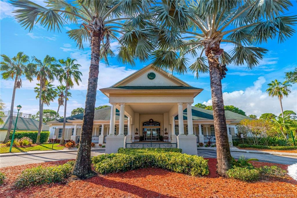 2216 Southeast Stonehaven Road Port St. Lucie, FL 34952 - Photo 65 of 67 a front view of a house with garden and patio