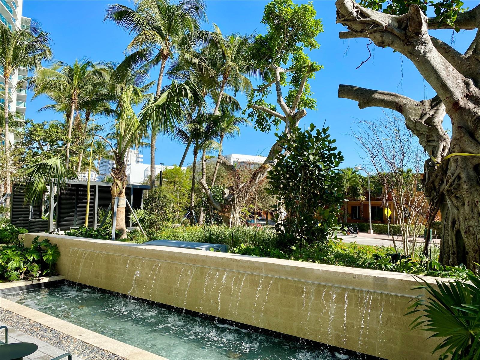 1500 Bay Road, Unit 1274S Miami Beach, FL 33139 - Photo 30 of 36 an outdoor view of garden with swimming pool