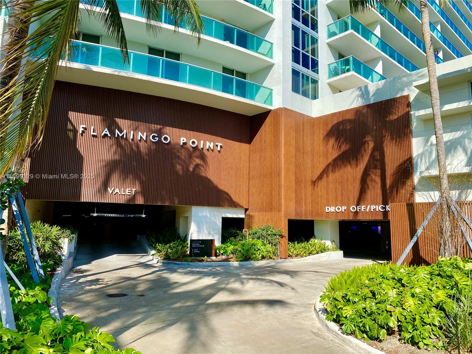 1500 Bay Road, Unit 1274S Miami Beach, FL 33139 - Photo 31 of 36 a front view of a building with a garden