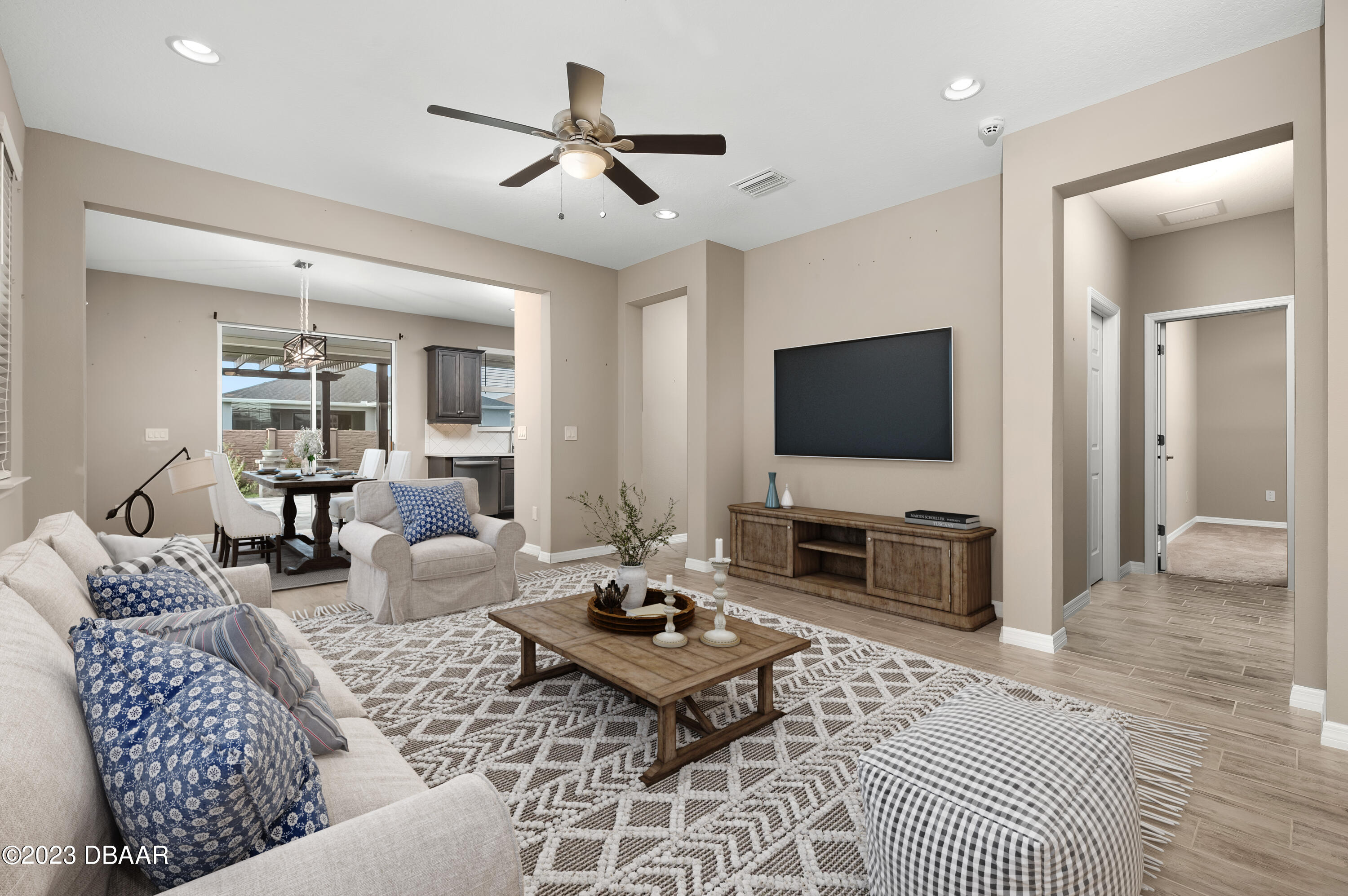 5658 Northwest 40th Loop Ocala, FL 34482 - Photo 13 of 80 a living room with furniture and a flat screen tv