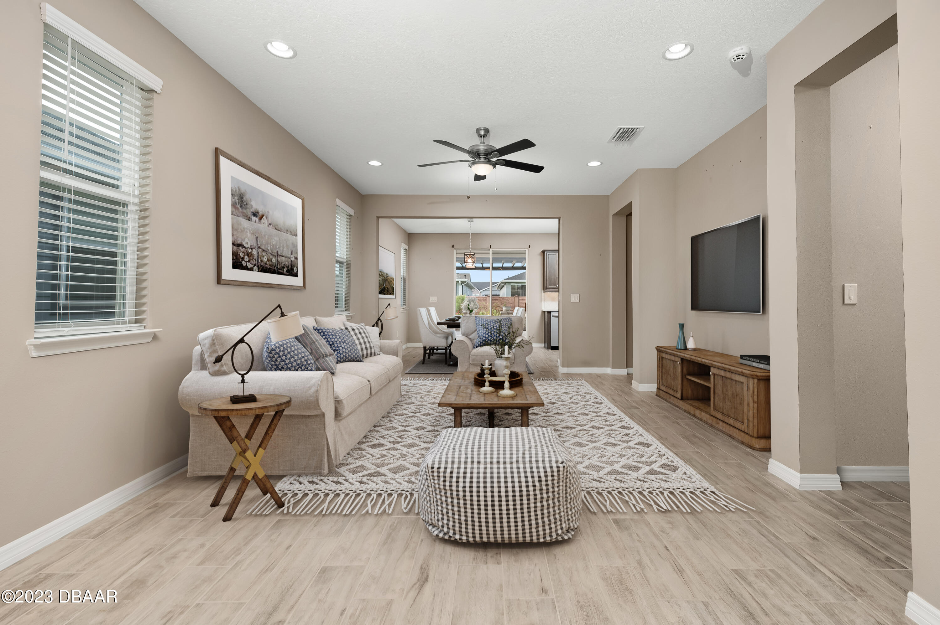 5658 Northwest 40th Loop Ocala, FL 34482 - Photo 15 of 80 a living room with furniture fireplace and a flat screen tv