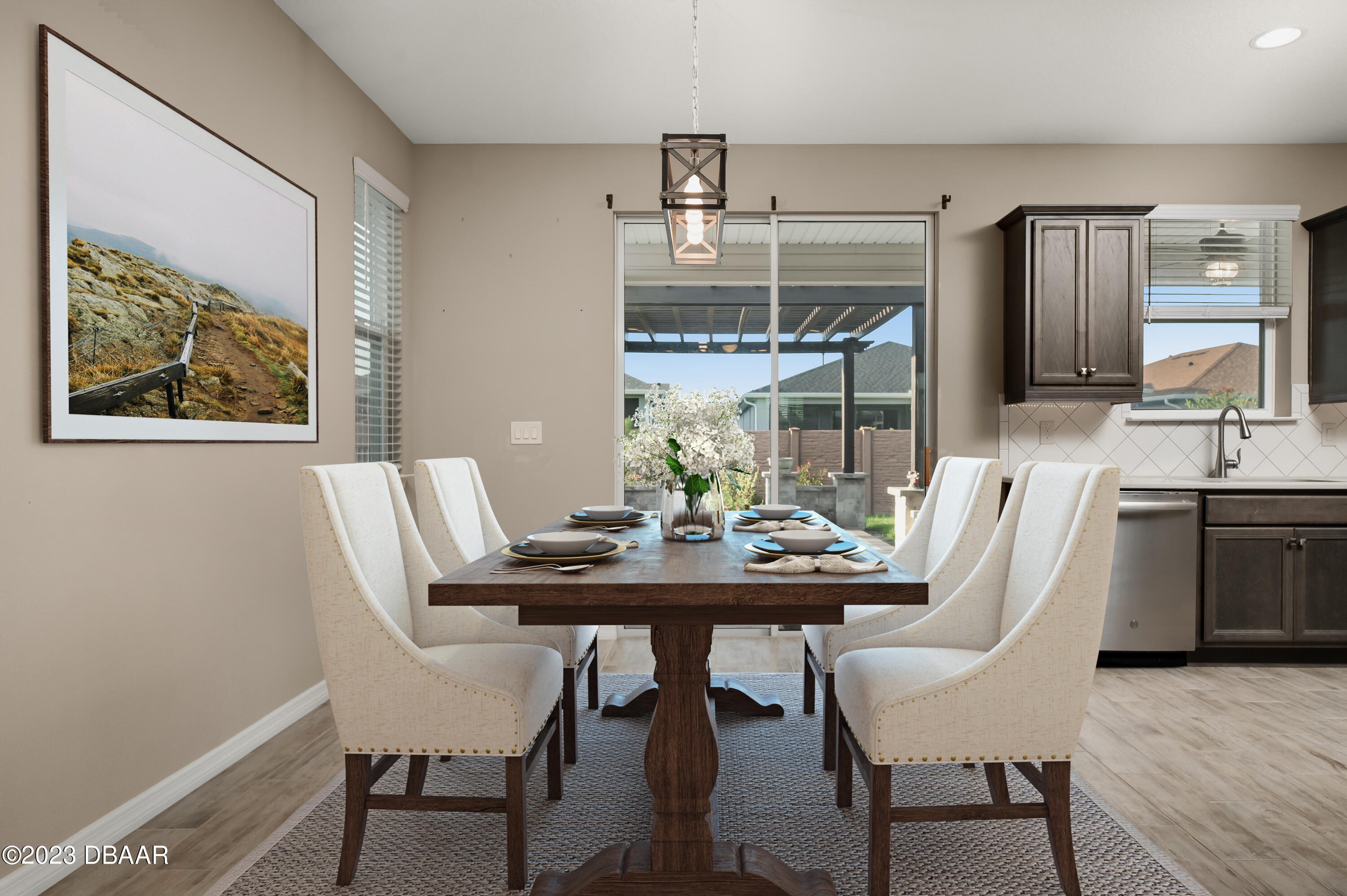 5658 Northwest 40th Loop Ocala, FL 34482 - Photo 21 of 80 a view of a dining room with furniture window and wooden floor