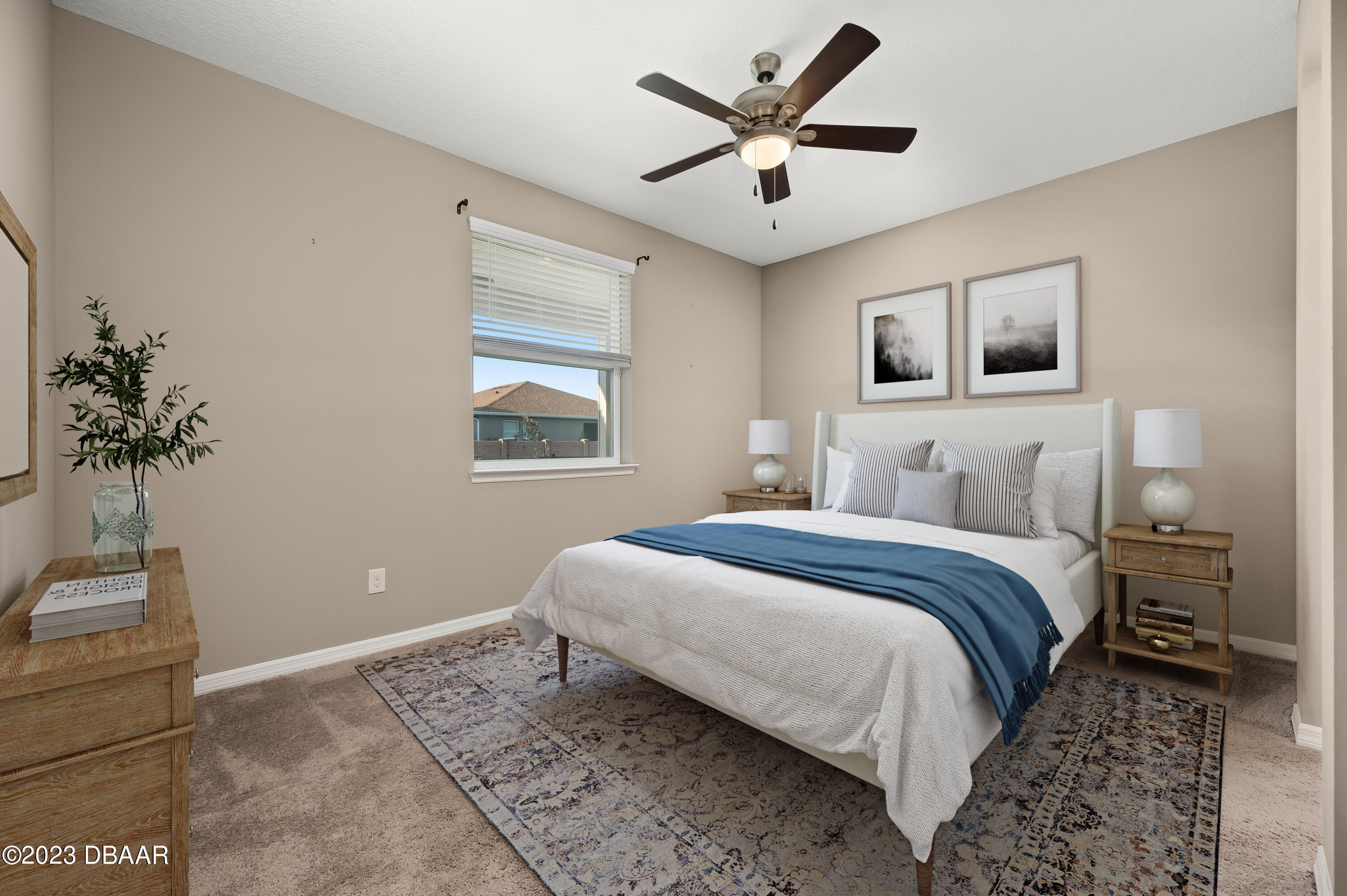 5658 Northwest 40th Loop Ocala, FL 34482 - Photo 34 of 80 a bedroom with a large bed and a window