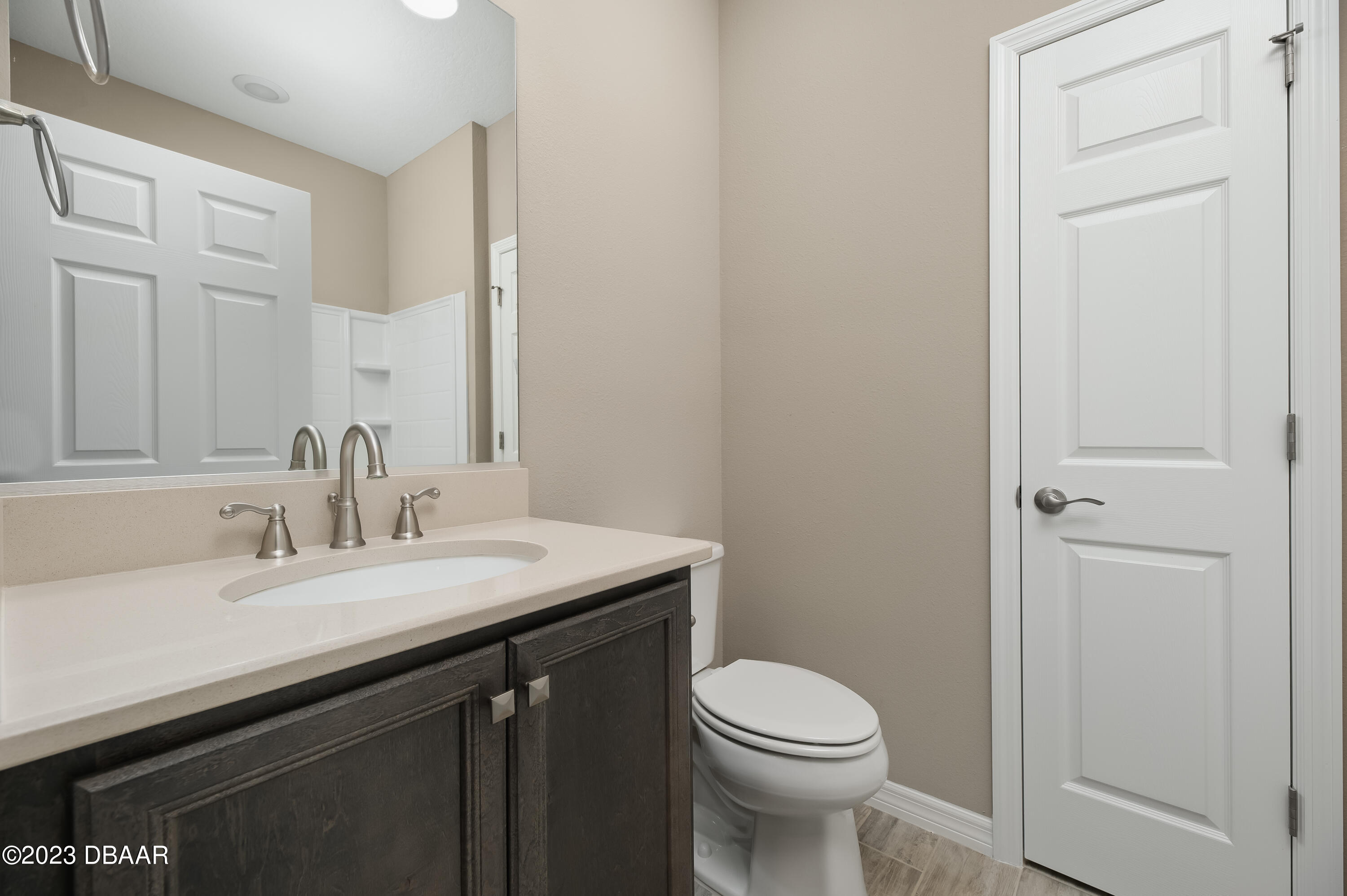 5658 Northwest 40th Loop Ocala, FL 34482 - Photo 45 of 80 a bathroom with a sink a toilet and a mirror