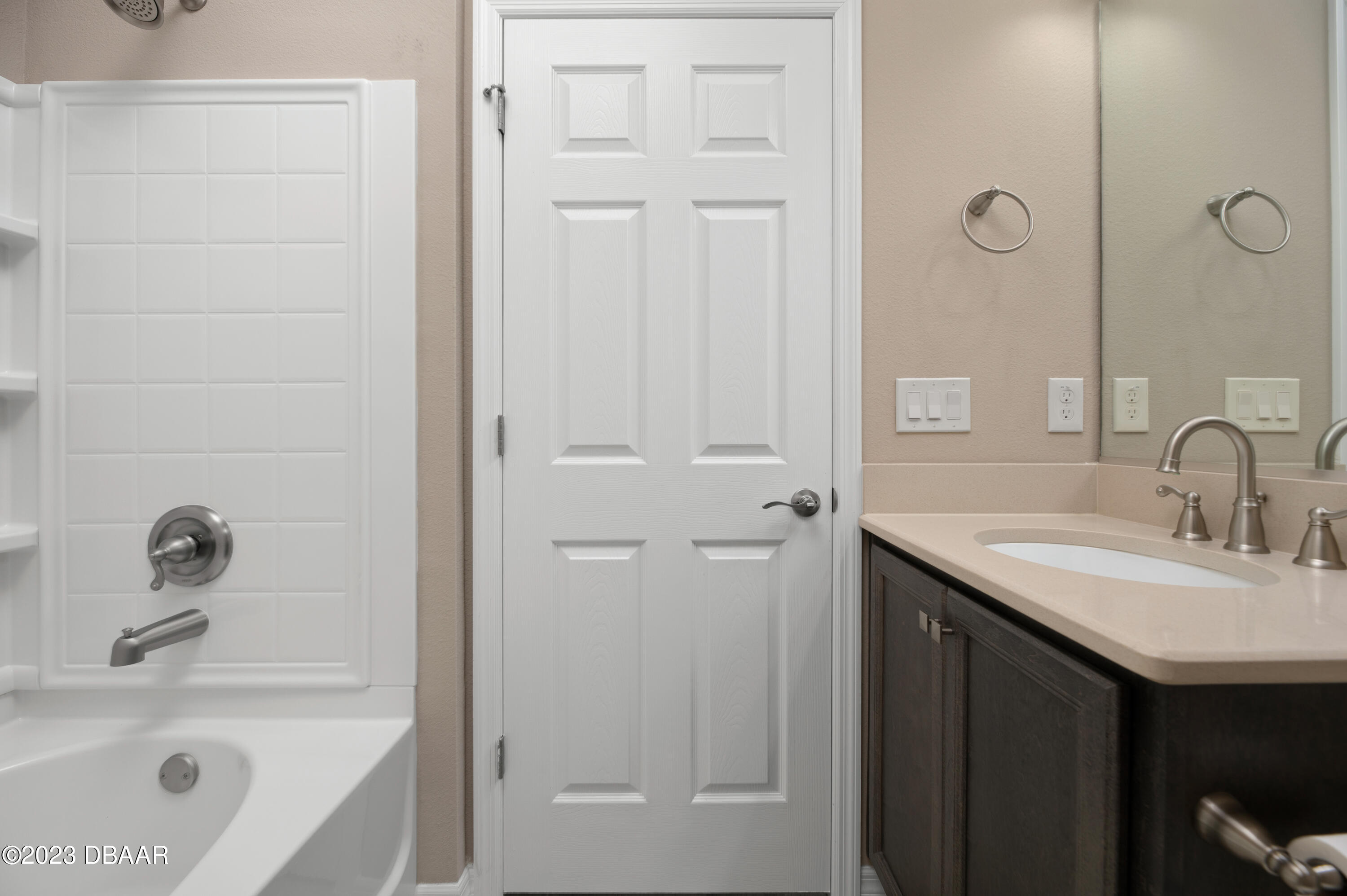 5658 Northwest 40th Loop Ocala, FL 34482 - Photo 46 of 80 a bathroom with a sink a mirror and a bathtub