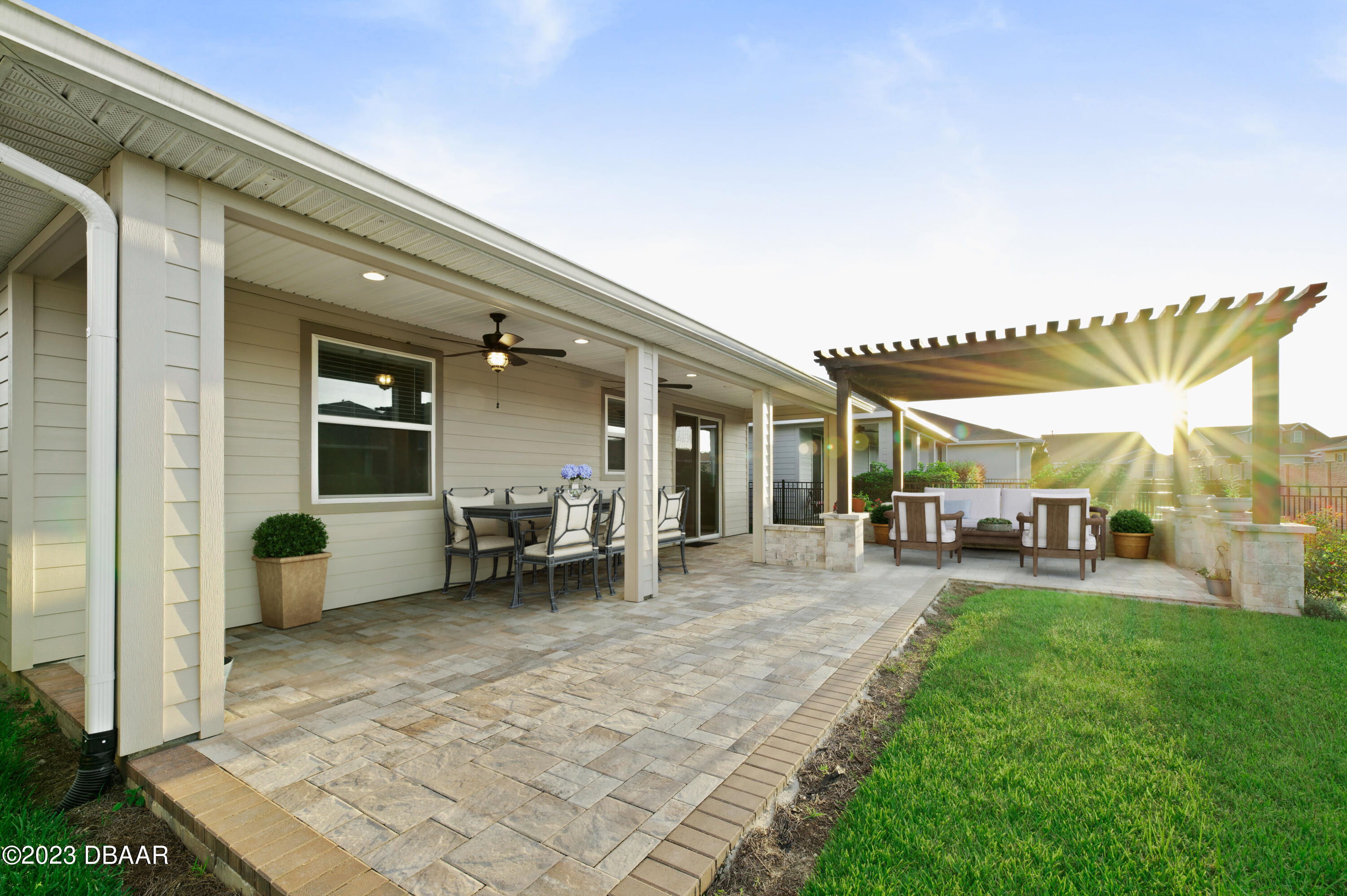 5658 Northwest 40th Loop Ocala, FL 34482 - Photo 5 of 80 a view of a house with a patio and a yard