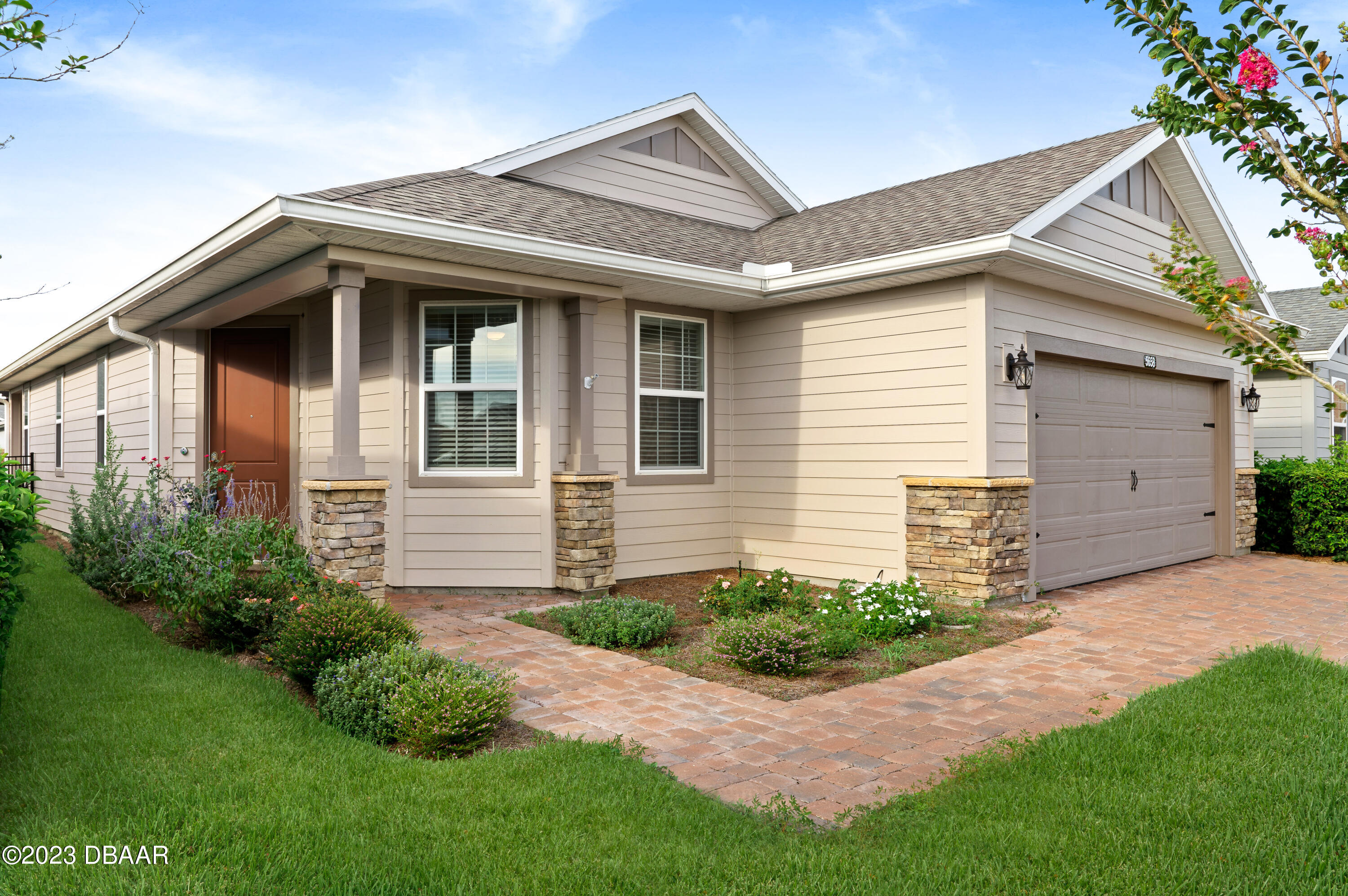 5658 Northwest 40th Loop Ocala, FL 34482 - Photo 54 of 80 a front view of a house with a yard