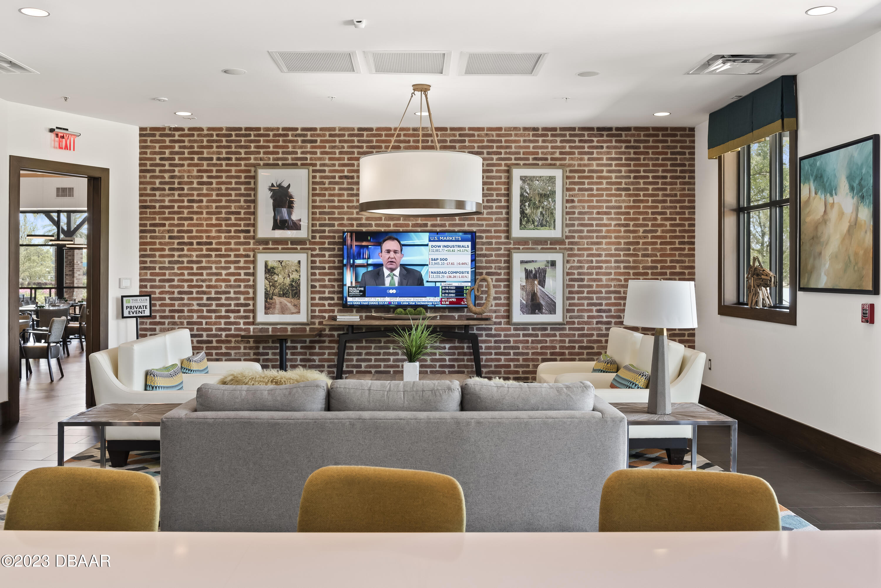 5658 Northwest 40th Loop Ocala, FL 34482 - Photo 67 of 80 a living room with furniture a flat screen tv and a fireplace