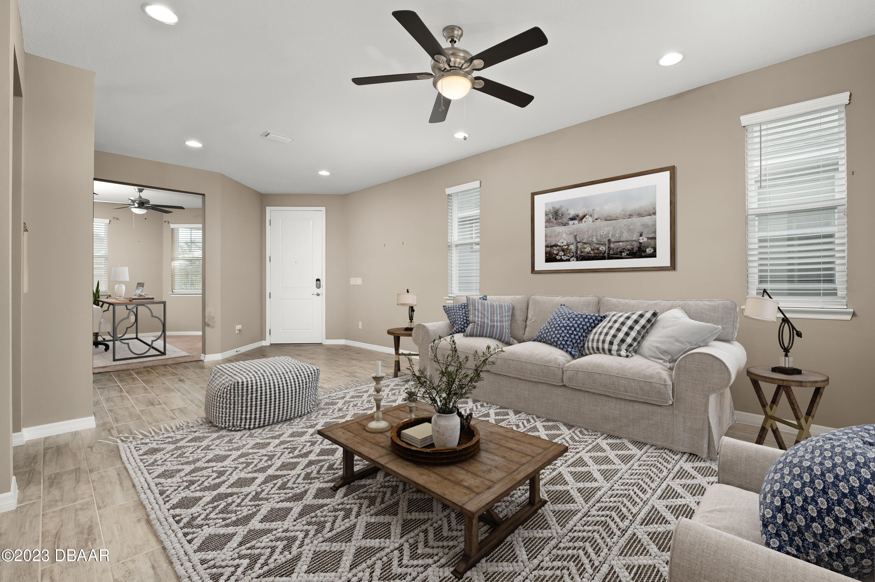 5658 Northwest 40th Loop Ocala, FL 34482 - Photo 9 of 80 a living room with furniture and a table