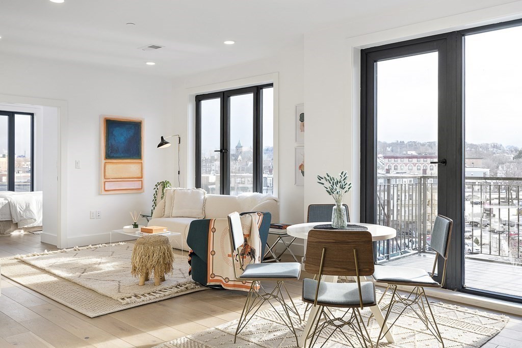 30 Penniman Road, Unit 307 Boston, MA 02134 - Photo 2 of 10 a living room with furniture and a large window
