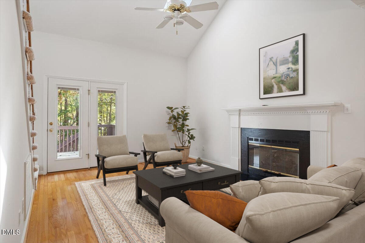 117 Colchis Court Cary, NC 27513 - Photo 4 of 39 a living room with furniture and a fireplace