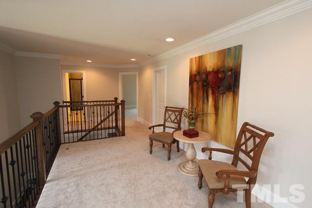1221 Harrison Ridge Road Wake Forest, NC 27587 - Photo 15 of 25 a view of a hallway with couches and dining table