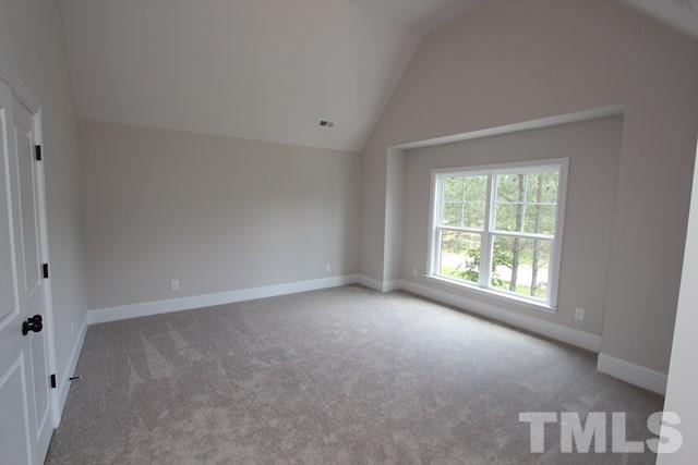 1221 Harrison Ridge Road Wake Forest, NC 27587 - Photo 17 of 25 an empty room with a window