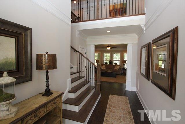 1221 Harrison Ridge Road Wake Forest, NC 27587 - Photo 22 of 25 a view of a hallway with wooden floor and staircase