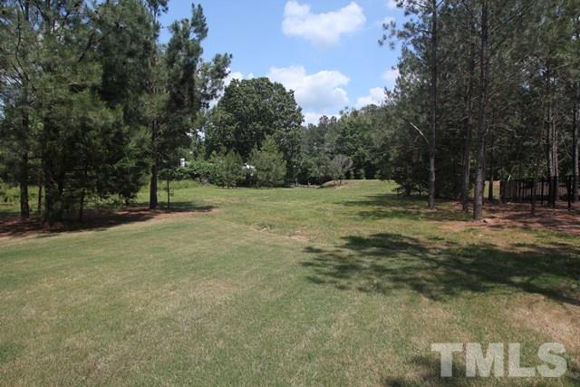 1221 Harrison Ridge Road Wake Forest, NC 27587 - Photo 25 of 25 a view of outdoor space with trees all around
