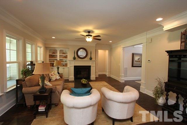 1221 Harrison Ridge Road Wake Forest, NC 27587 - Photo 4 of 25 a living room with furniture a fireplace and a window