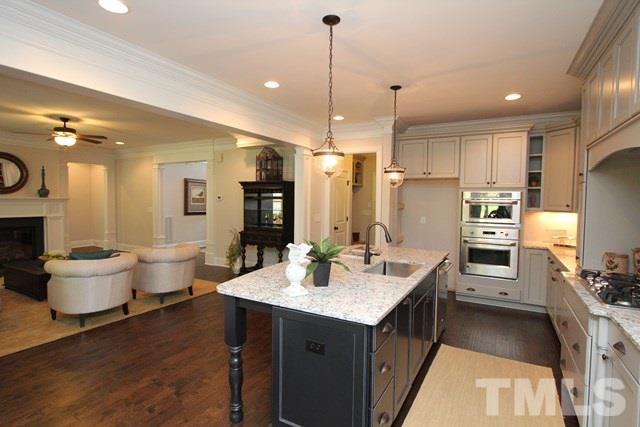 1221 Harrison Ridge Road Wake Forest, NC 27587 - Photo 8 of 25 a kitchen with a sink stove and refrigerator