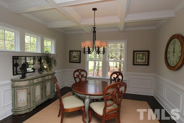 1221 Harrison Ridge Road Wake Forest, NC 27587 - Photo 10 of 25 a kitchen with a table chairs a stove and a window