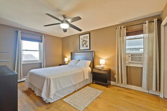 a bedroom with a bed and window