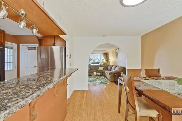 a view of a living room and dining room