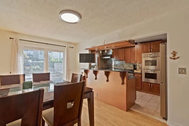 a view of a dining room with furniture window and outside view