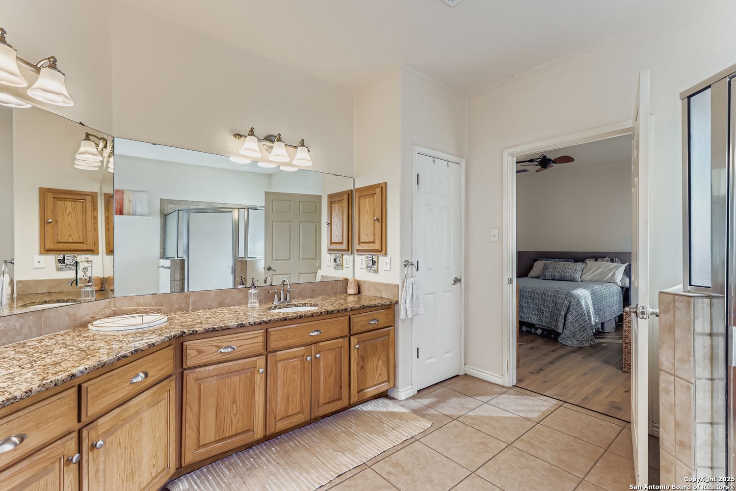 118 Santa Fe Seguin, TX 78155 - Photo 15 of 44 a spacious bathroom with a granite countertop sink and mirror