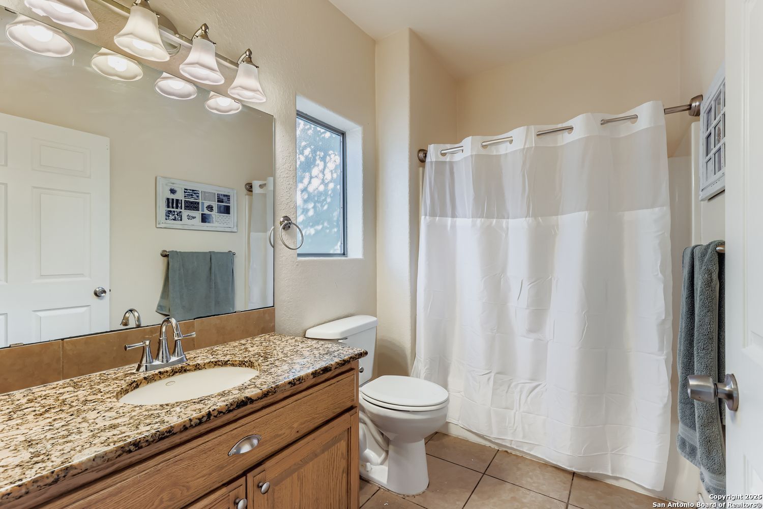 118 Santa Fe Seguin, TX 78155 - Photo 20 of 44 a bathroom with a granite countertop sink toilet and shower