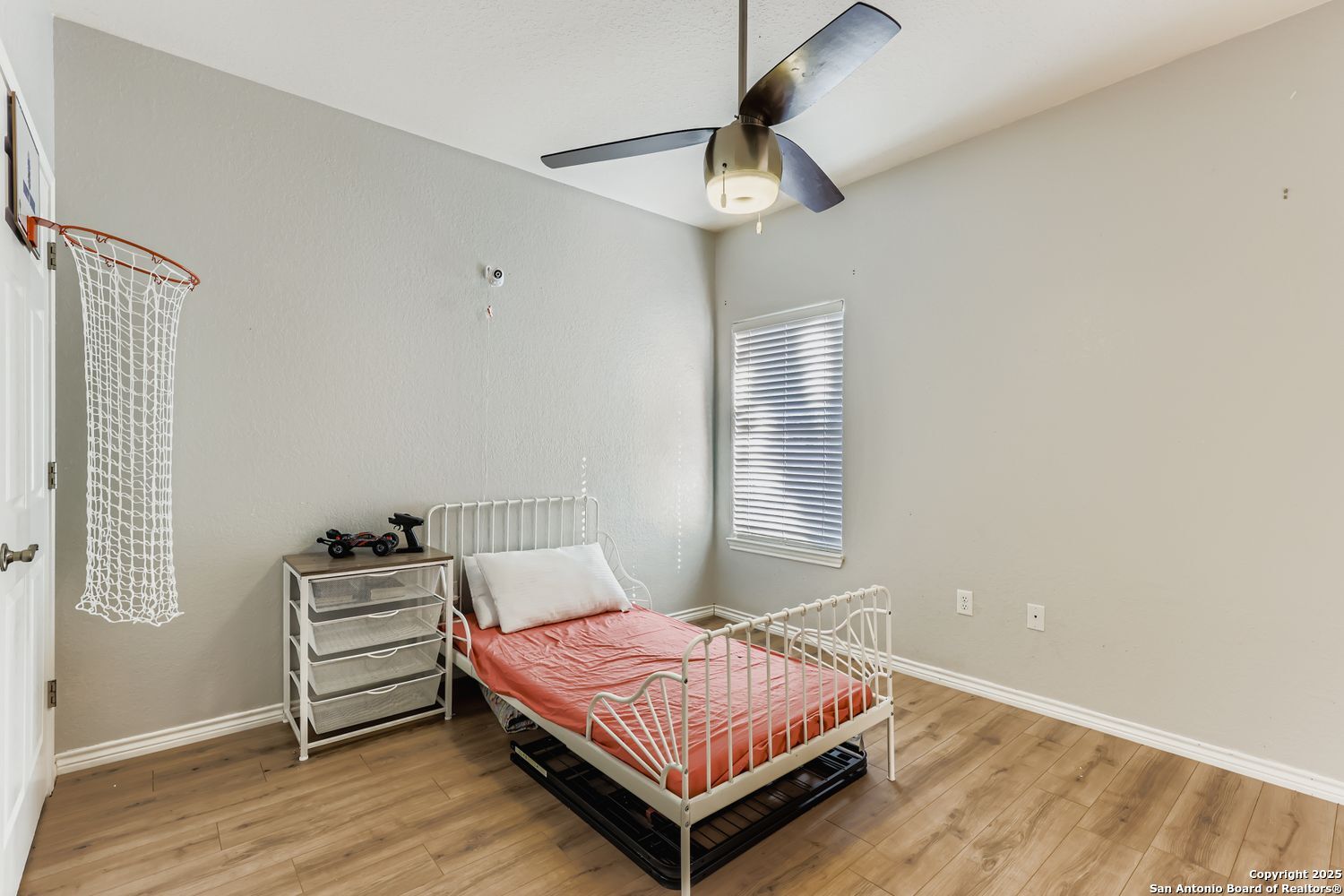 118 Santa Fe Seguin, TX 78155 - Photo 22 of 44 a bedroom with a bed and a chandelier