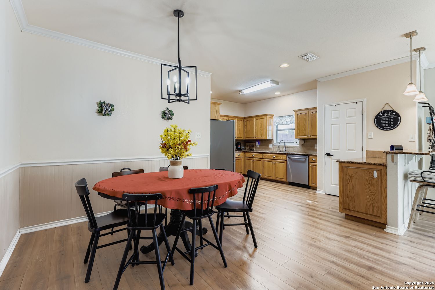 118 Santa Fe Seguin, TX 78155 - Photo 10 of 44 a view of a dining room and livingroom with furniture wooden floor a chandelier