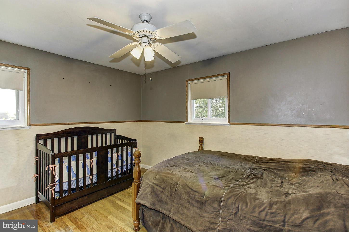 6257 Gilston Park Road Baltimore, MD 21228 - Photo 14 of 29 wooden floor in a hall with a window