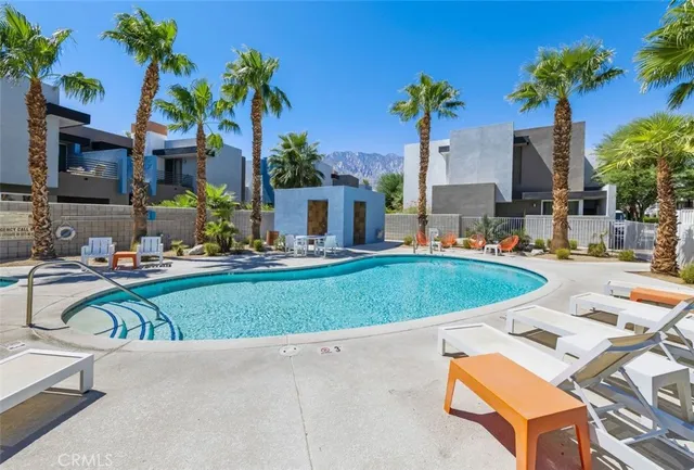 a view of a swimming pool with a lounge chairs
