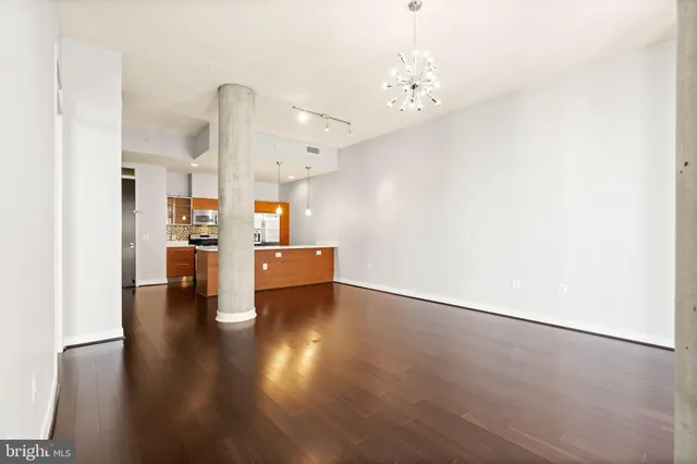 a view of a kitchen with wooden floor