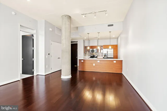 a view of a kitchen with wooden floor
