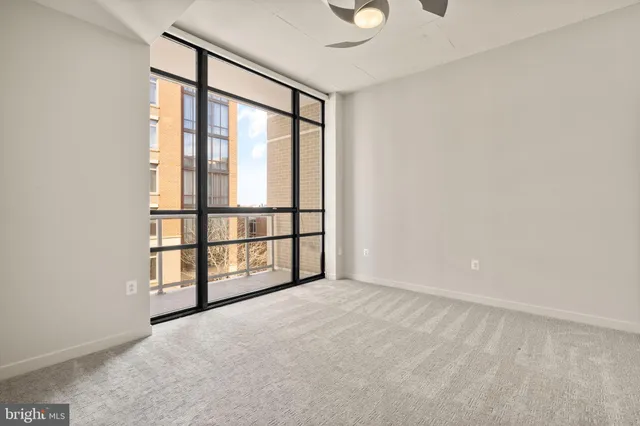 an empty room with windows with walls