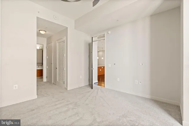 an empty room with closet area