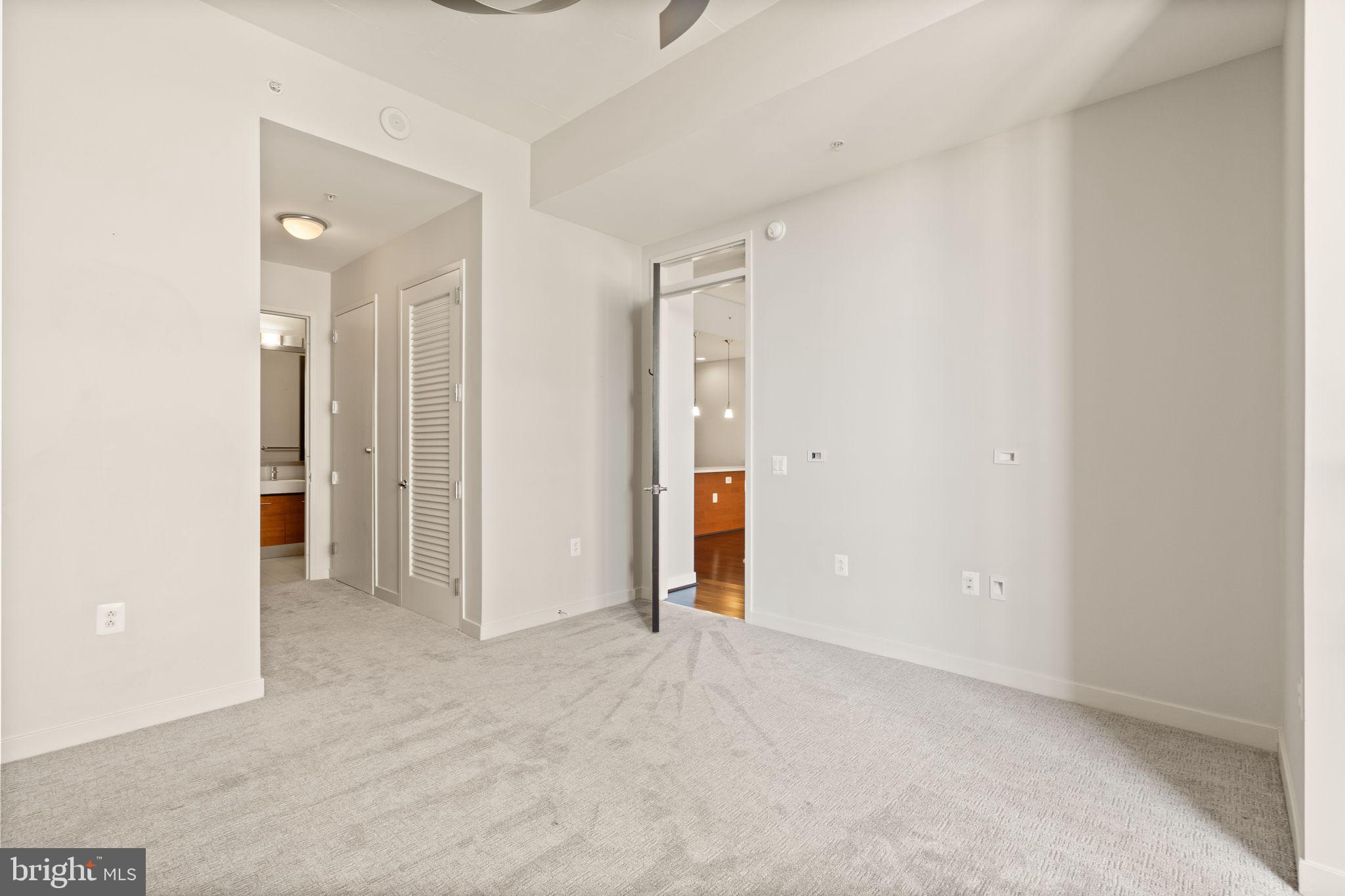 12025 New Dominion Parkway, Unit 406 Reston, VA 20190 - Photo 22 of 31 an empty room with closet area