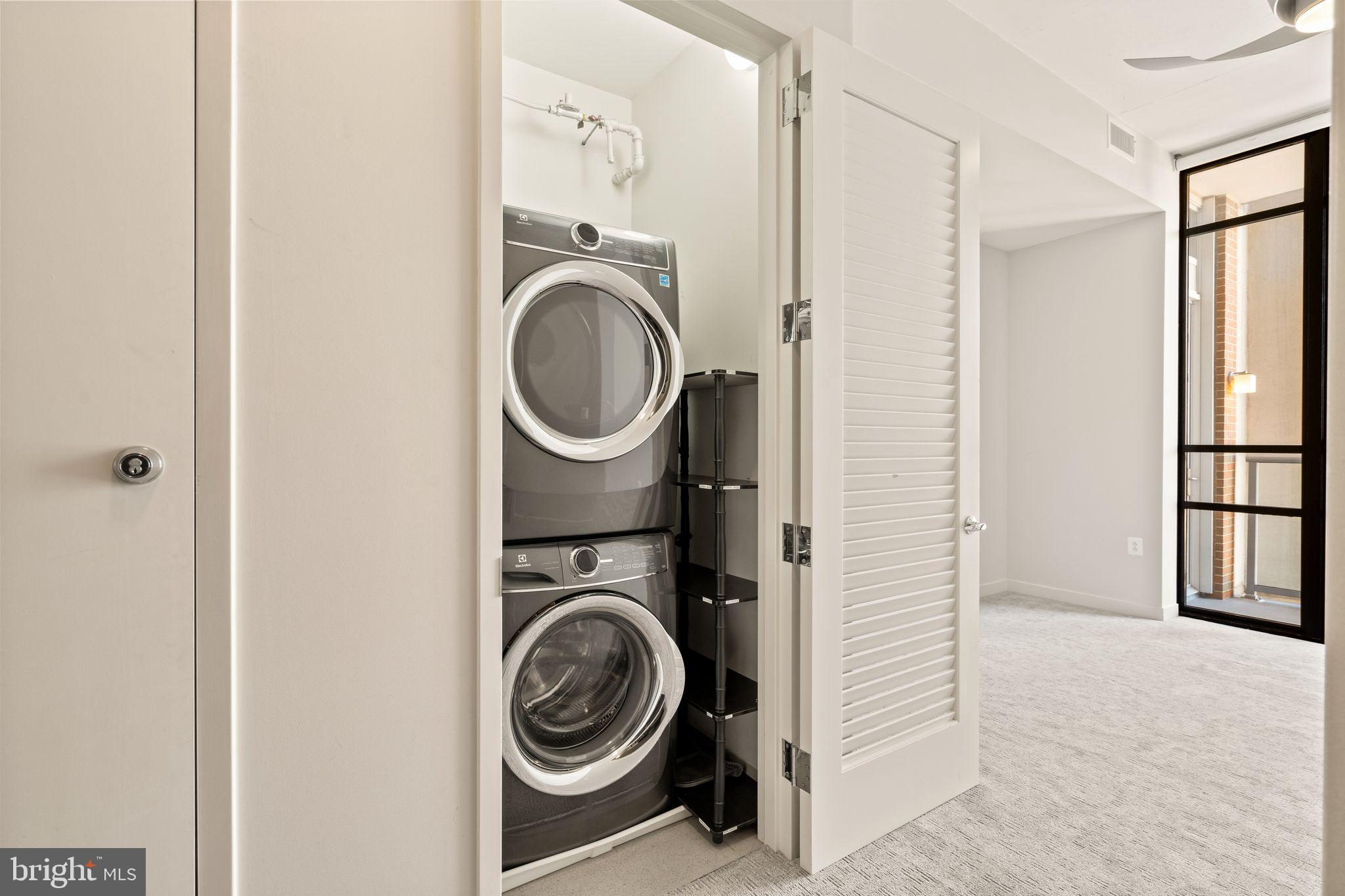 12025 New Dominion Parkway, Unit 406 Reston, VA 20190 - Photo 23 of 31 a utility room with dryer and washer
