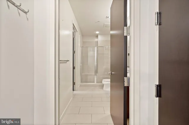 a bathroom with a glass shower door