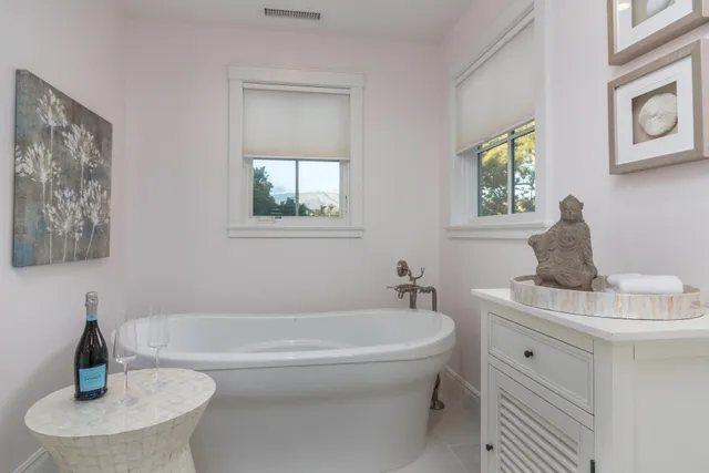 a bathroom with a tub and sink