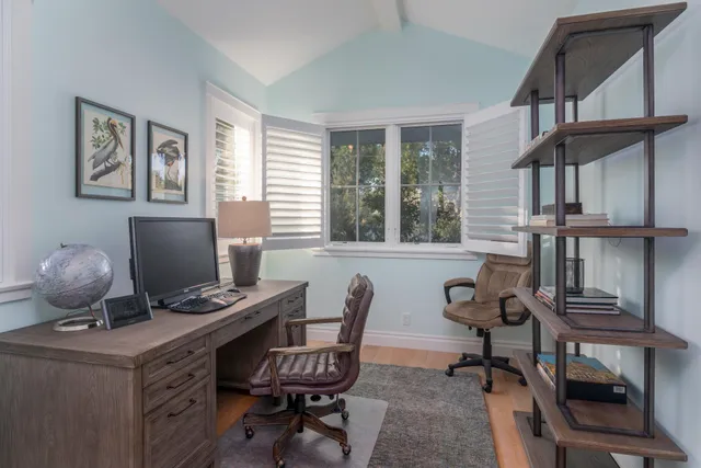 a workspace with furniture and a window