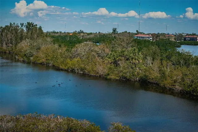 a view of a golf course with a lake view
